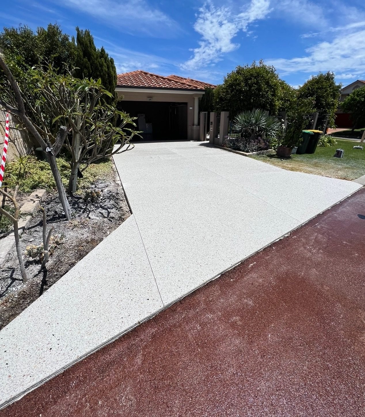 Exposed aggregate driveway running from the garage to the street frontage, Thornton